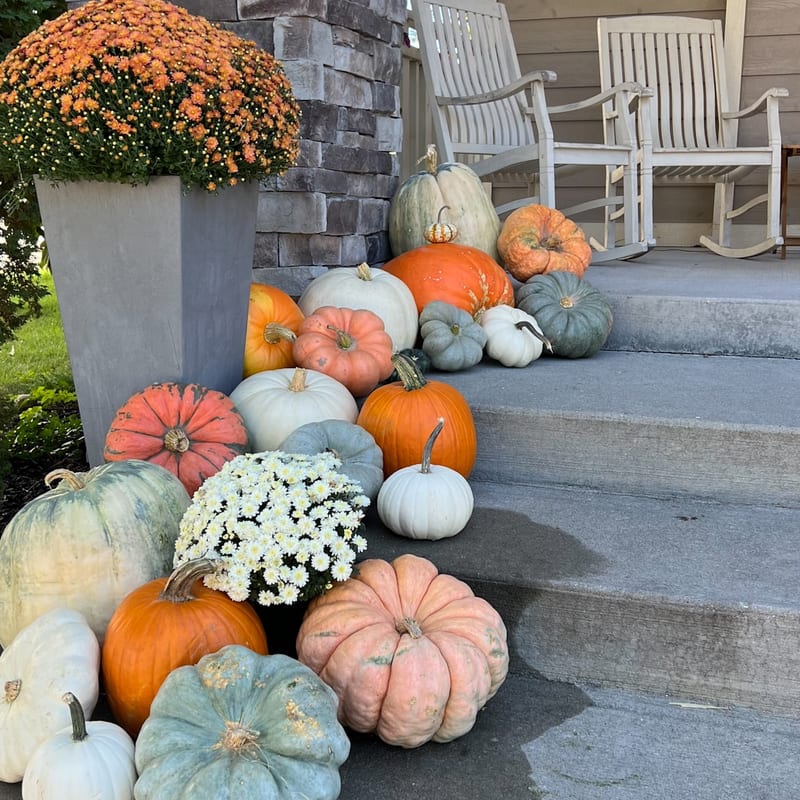 Cozy autumn porch with lanterns and pumpkins